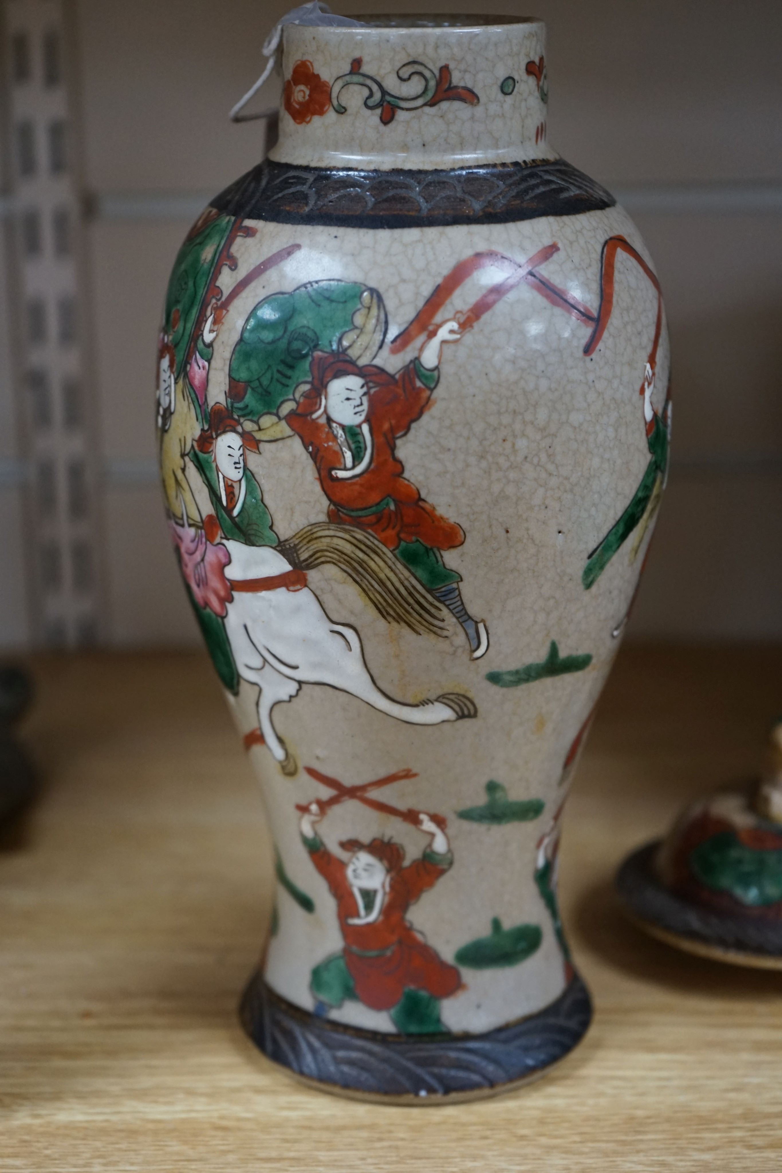 A late 19th century Chinese crackle glaze famille rose baluster vase and cover 30cm